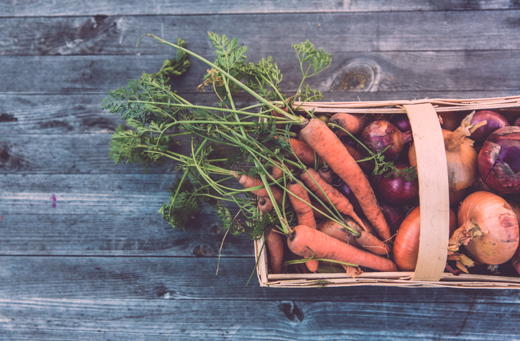 Basket of carrots and onions