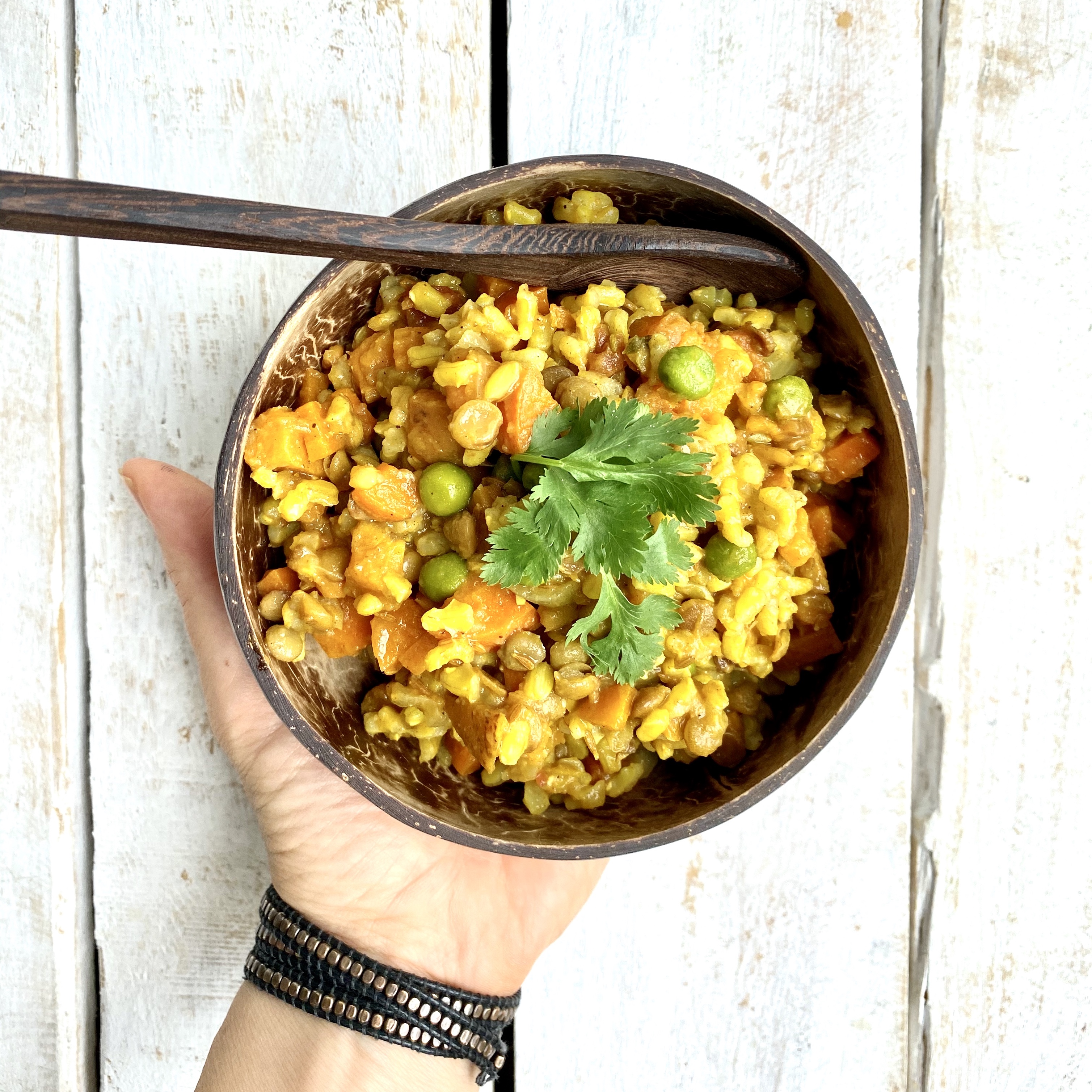 A bowl of golden rice and vegetables