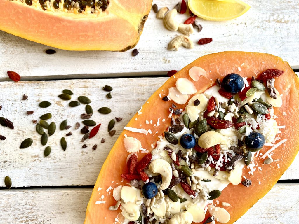 Papaya filled with fruit, nuts and seeds